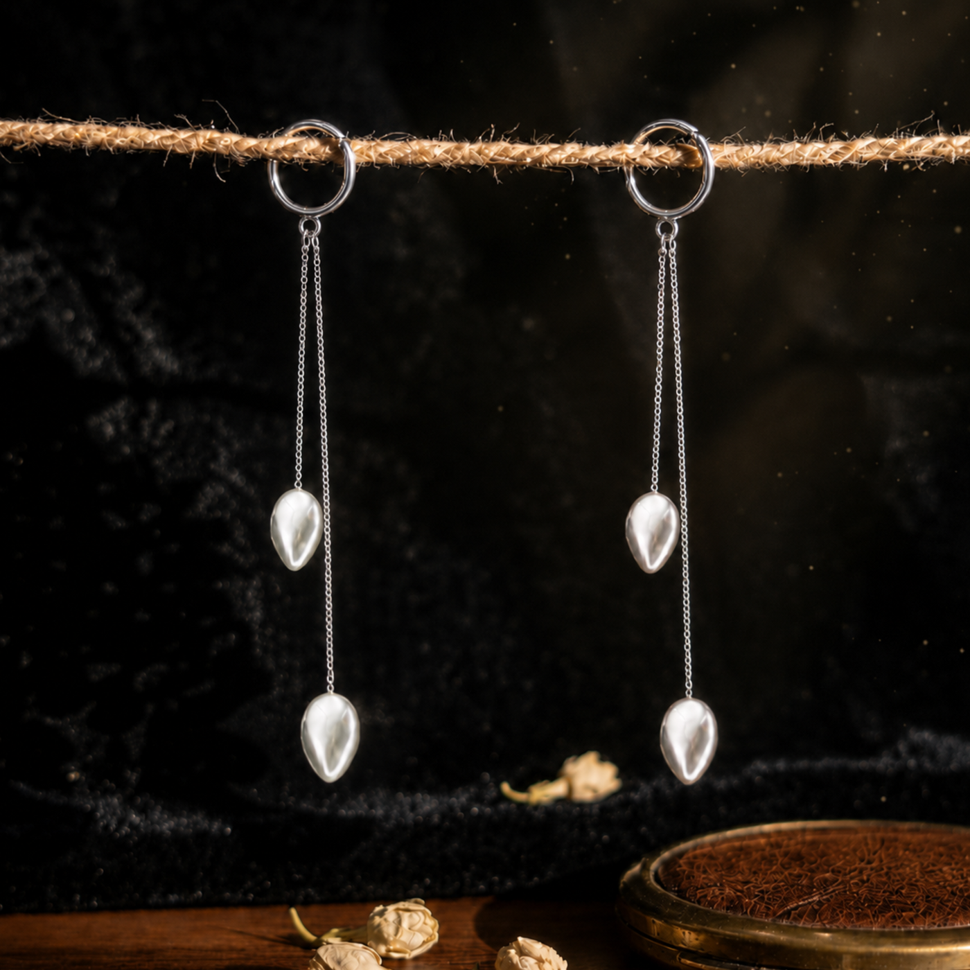 Sterling silver twin chain drop earrings with teardrop beads hanging from a rope